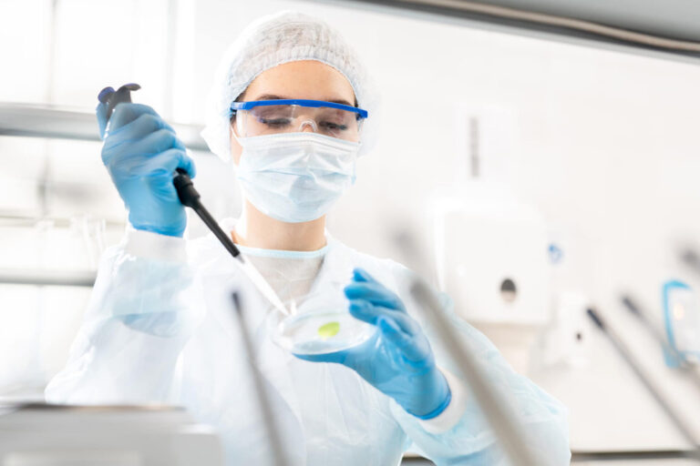 scientist in lab with petri-dish